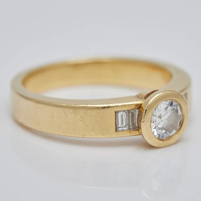 Ring, 750er Gelbgold, Brillant und Diamanten.