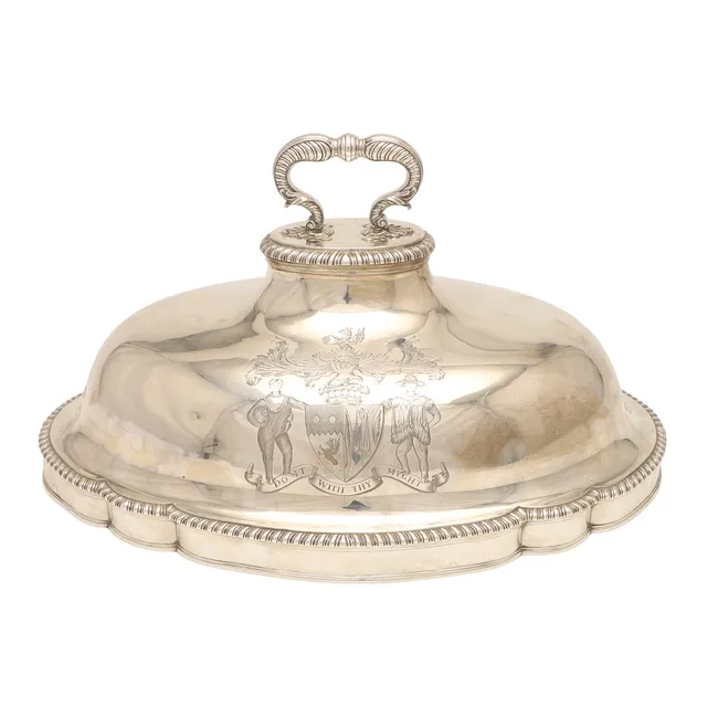 A GEORGE III CRESTED SILVER MEAT DISH COVER.