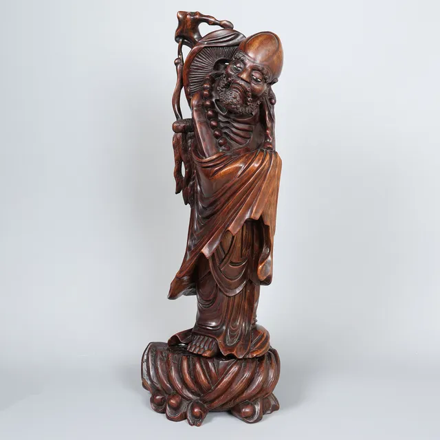 A LARGE CHINESE HARDWOOD FIGURE.