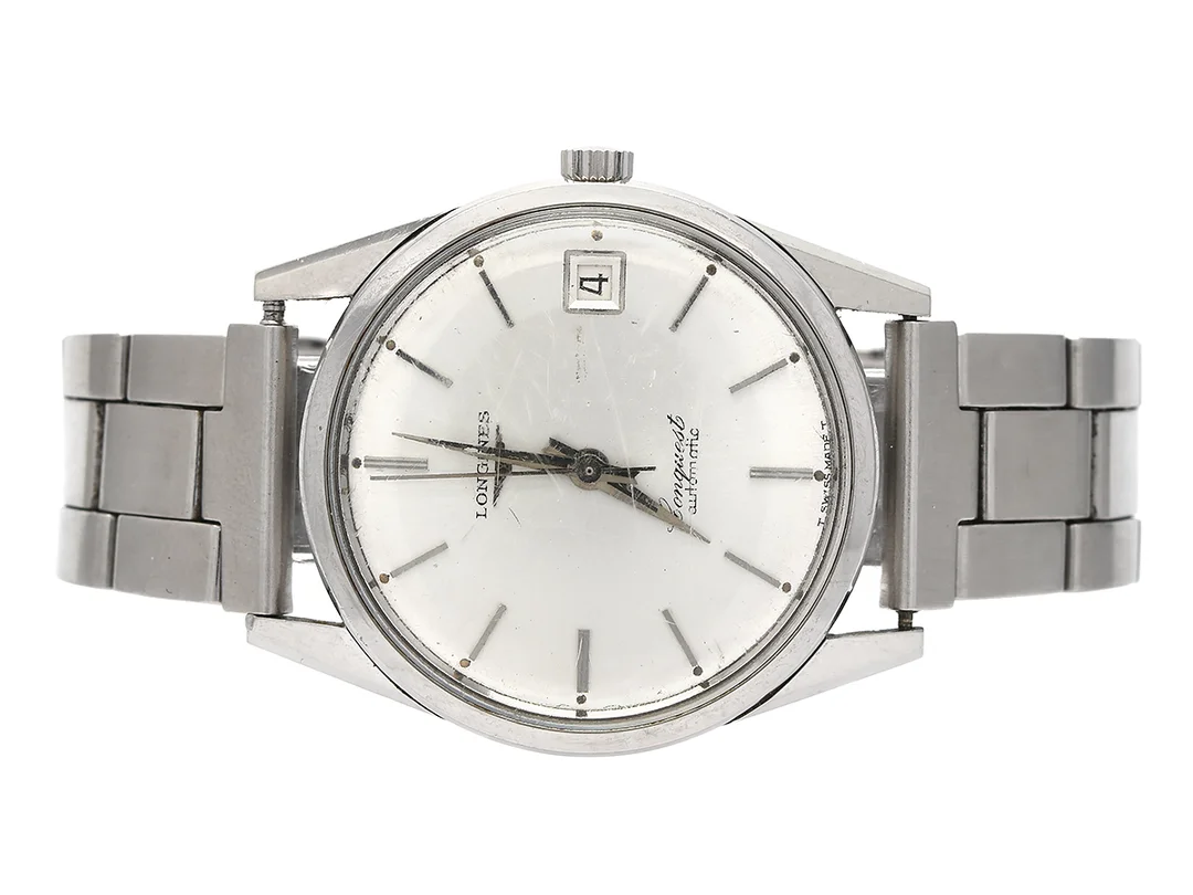 LONGINES, Conquest (T Swiss Made T), Cal 291, Serie nr. 13496552, Boett nr. 7771-1/563, herrur, 36 mm, stål, automatisk, plexiglas, datum, skadad urtavla, ca 1966, metallänk ej original. — Klockor/Longines — Kaplans