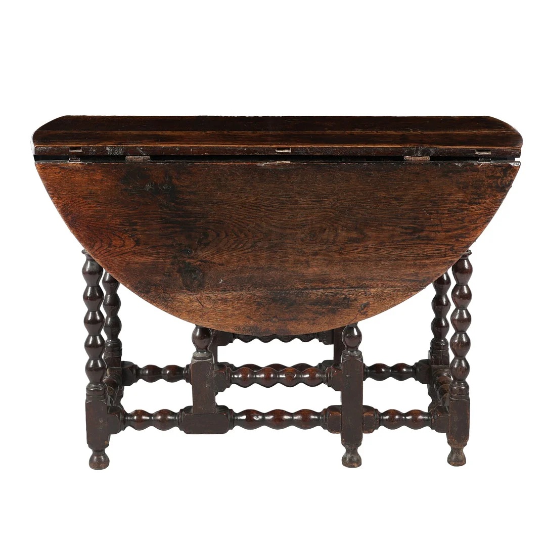 A CHARLES II OAK DROP LEAF DINING TABLE. — Tables — Bishop & Miller