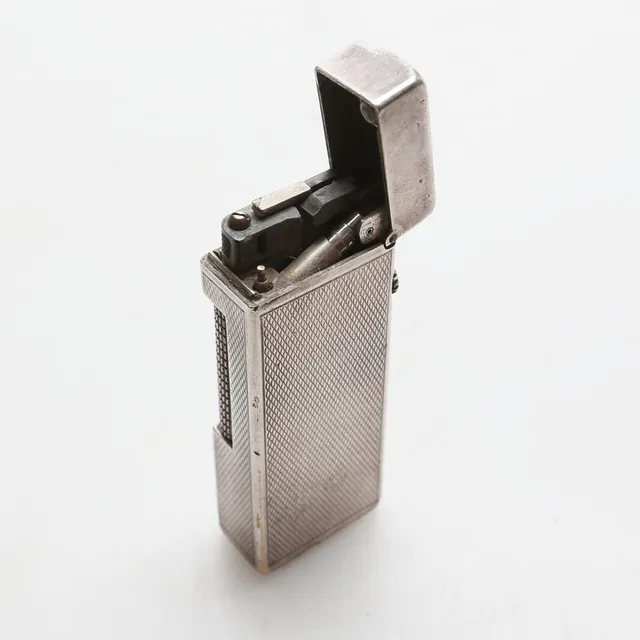 TÄNDARE, metall, Dunhill, 1900-tal.
