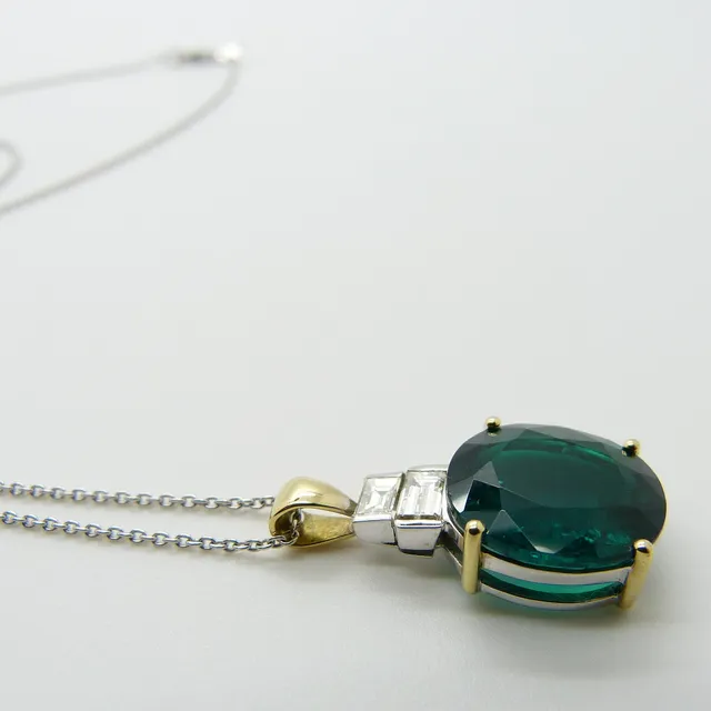 DIAMOND & CREATED EMERALD NECKLACE.