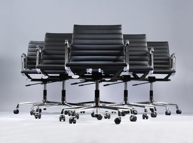 Charles Eames. A set of six office chairs in black leather, model EA-117. (6)