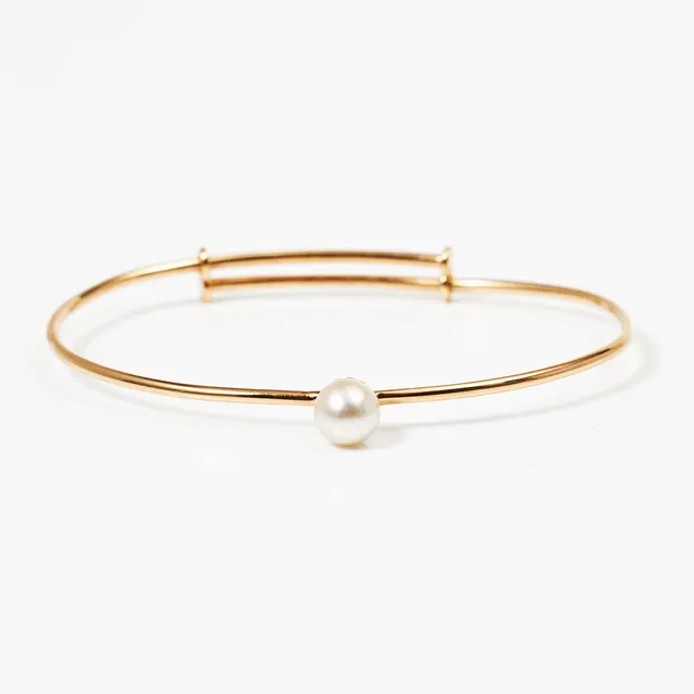 ARMRING, 18 k guld, med odlad pärla, Nygård & Son Chr, Linköping 1941.