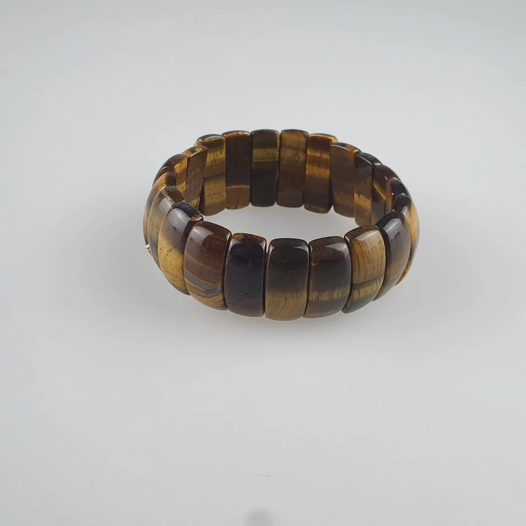- TIGERAUGE-ARMBAND, flexibel aufgezogen, Design E.v.Sch. — Bracelets — Auktionshaus Blank