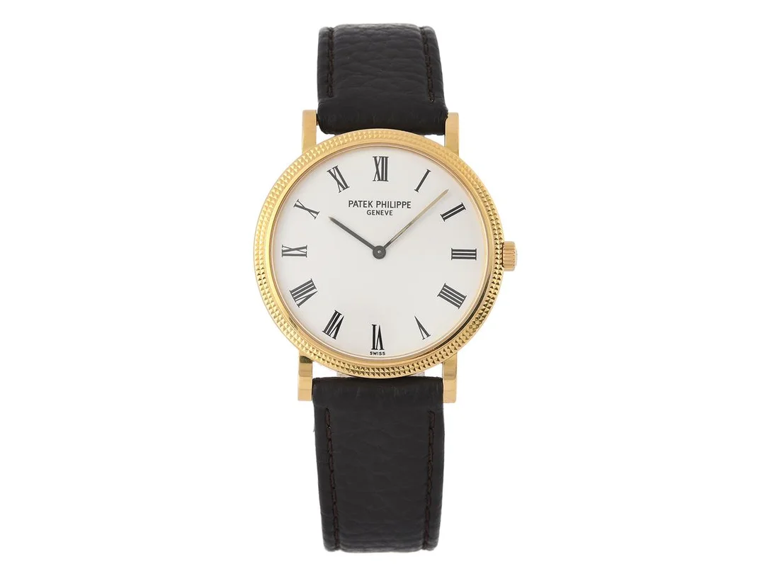 PATEK PHILIPPE, Geneve, Calatrava, "Geneva Seal", Cal 240/111, Serie nr. 1208714, Ref nr. 5120J-001, Boett nr. 4298511, herrur, 35 mm, 18K guld, automatisk (microrotor i 18K guld), safirglas, skadade visare, glasbaksida, defekt (akut servicebehov), läderband, originalspänne i 18K guld, cert, maj 2007, box, ytterkartong. — Klockor/Patek Philippe — Kaplans