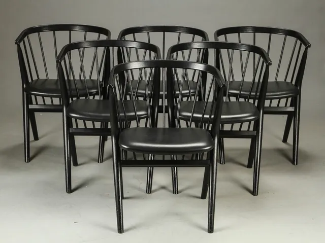 Helge Sibast. Six spoke-back chairs in black-varnished oak, model 8(6)