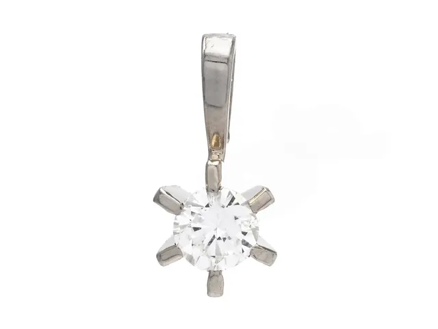 ENSTENSHÄNGE, 18K vitguld, briljant ca 0,15 ct, höjd 10 mm, vikt 0,4 g, diamant med skada.