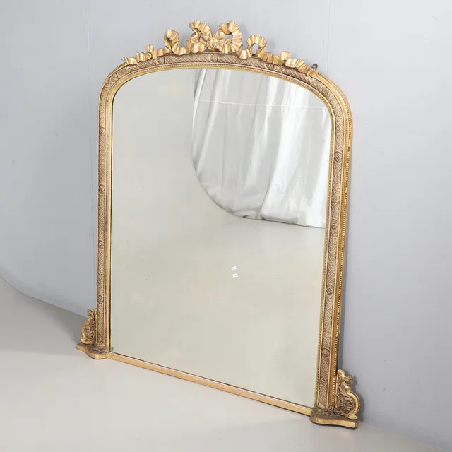 A VICTORIAN GILT GESSO OVERMANTEL MIRROR.
