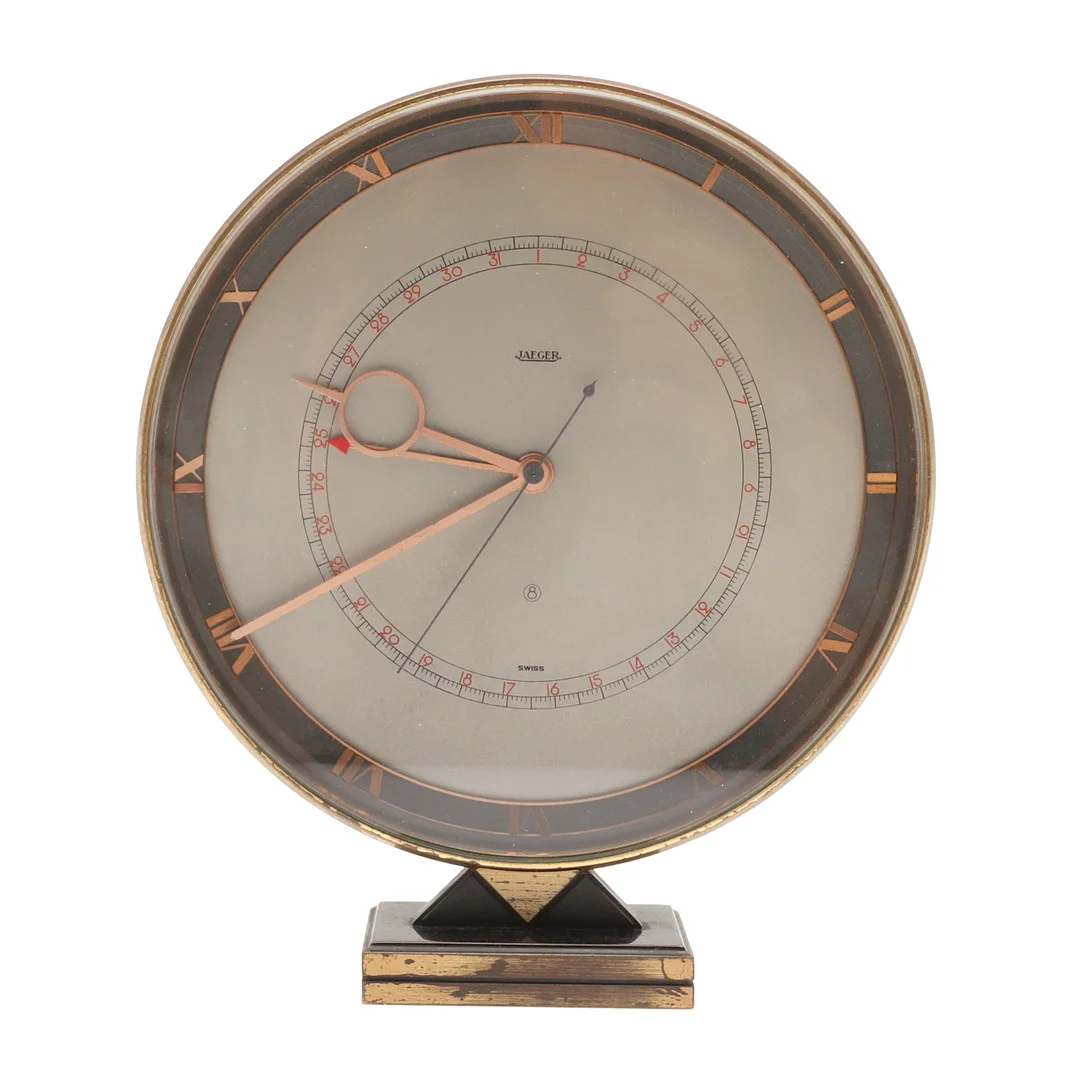 AN ART DECO JAEGER-LE-COULTRE BRASS DESK CLOCK. — Other clocks — Lawrences Auctioneers