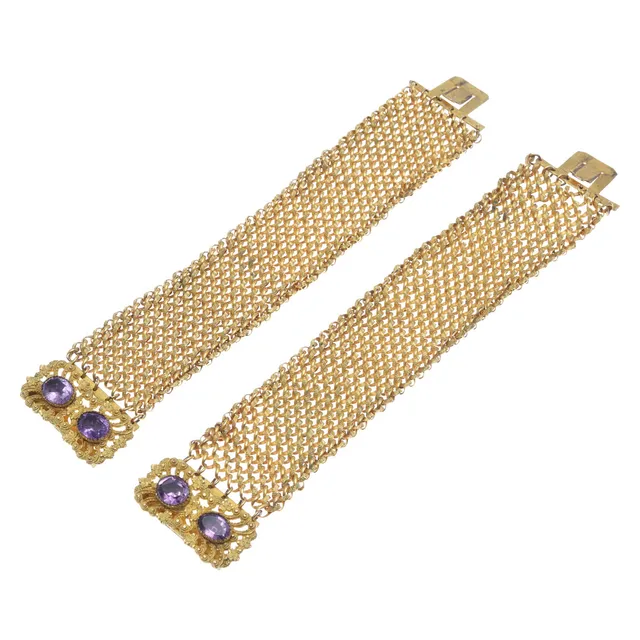 A PAIR OF 19TH CENTURY AMETHYST AND GILT BRACELETS.