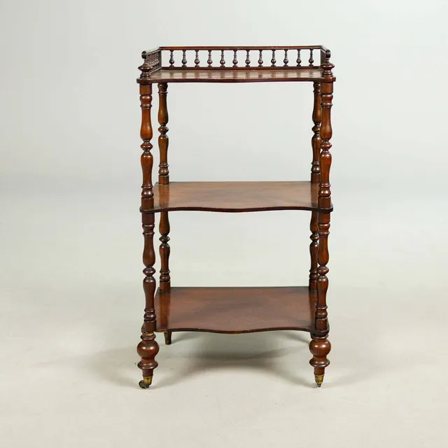 A VICTORIAN MAHOGANY WHATNOT.