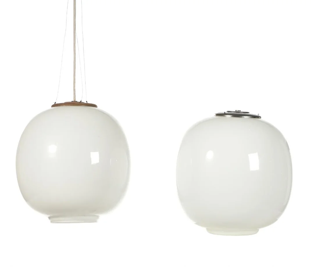Vilhelm Lauritzen: “Radiohuspendel”. A pair og opaline glass pendants with nickled metal mounting for wire hanging. (2) — Modern Lighting — Bruun Rasmussen