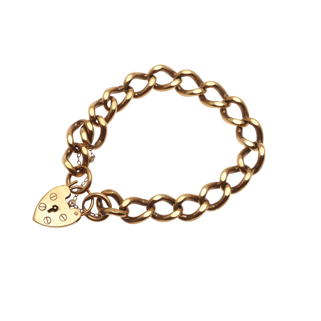A 9CT GOLD CURB LINK BRACELET. — Bracelets — Lawrences Auctioneers