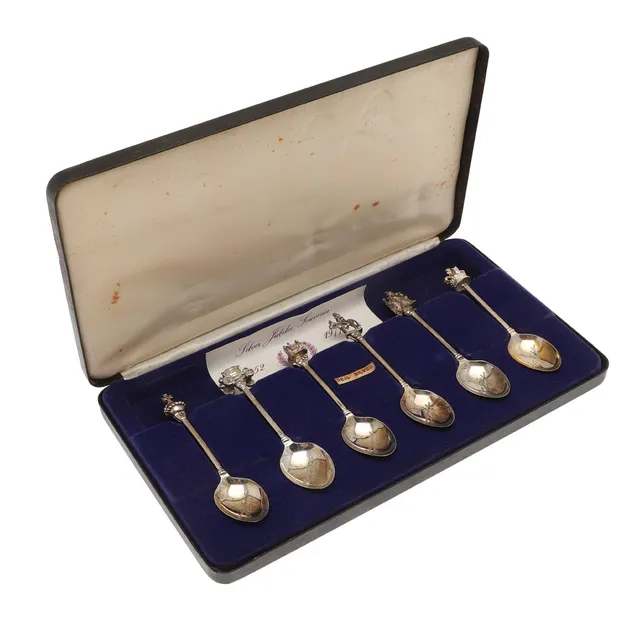 A CASED SET OF SIX SILVER JUBILEE SOUVENIR SPOONS.