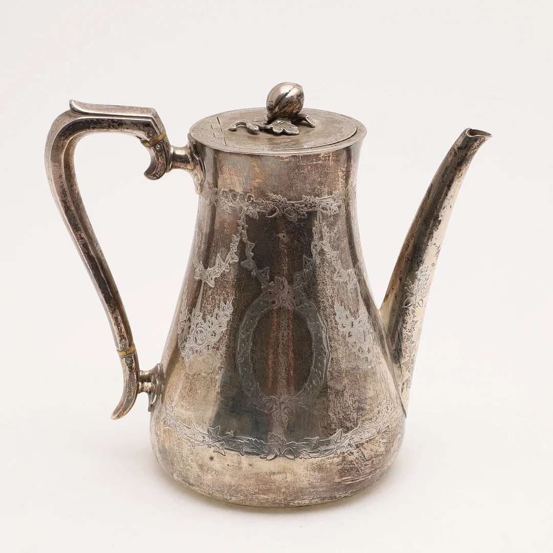 A VICTORIAN ENGRAVED COFFEE POT. — Silver — Lawrences Auctioneers