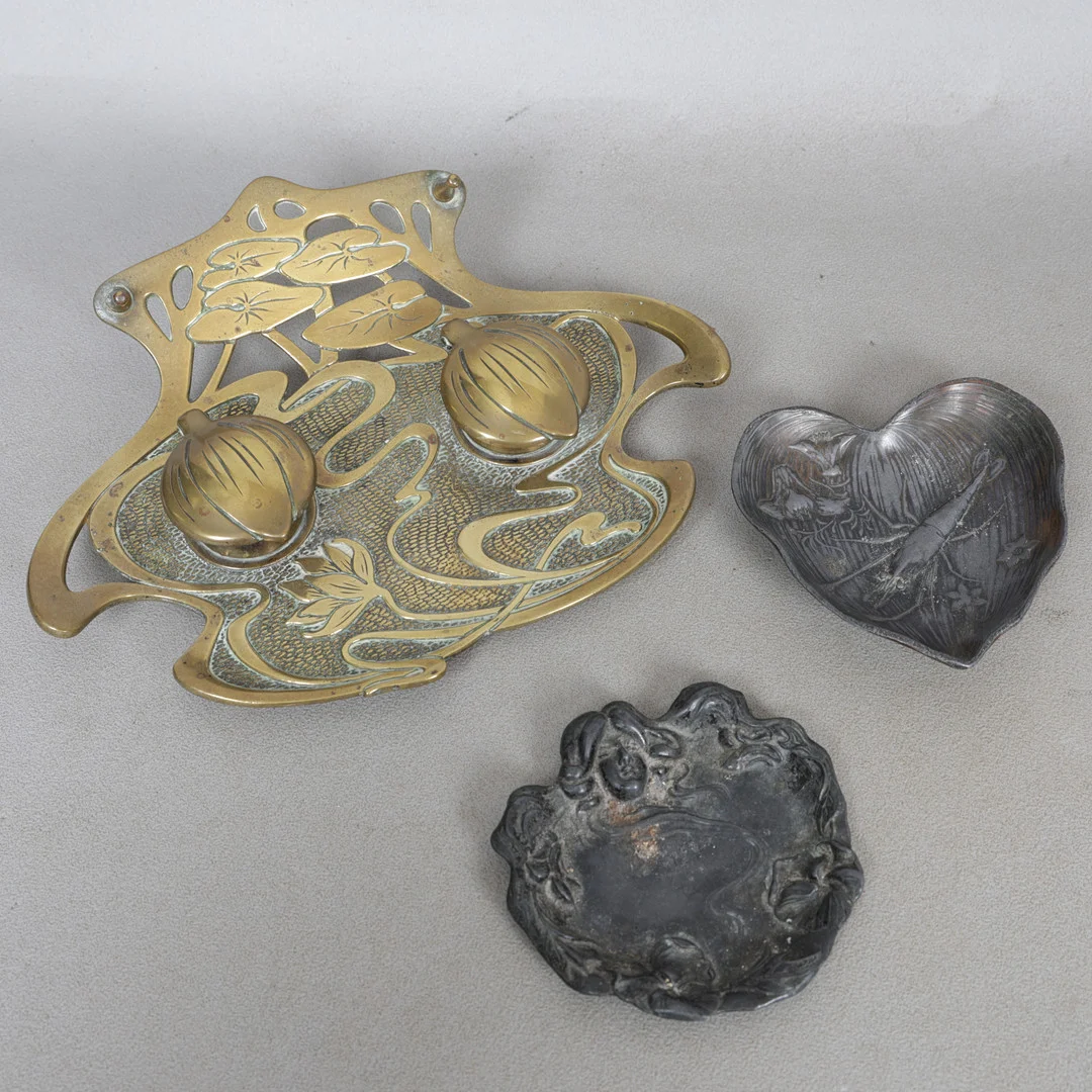 AN ART NOUVEAU BRASS DESK STAND AND TWO DISHES (3). — Pewter, Brass & Copper — Bishop & Miller