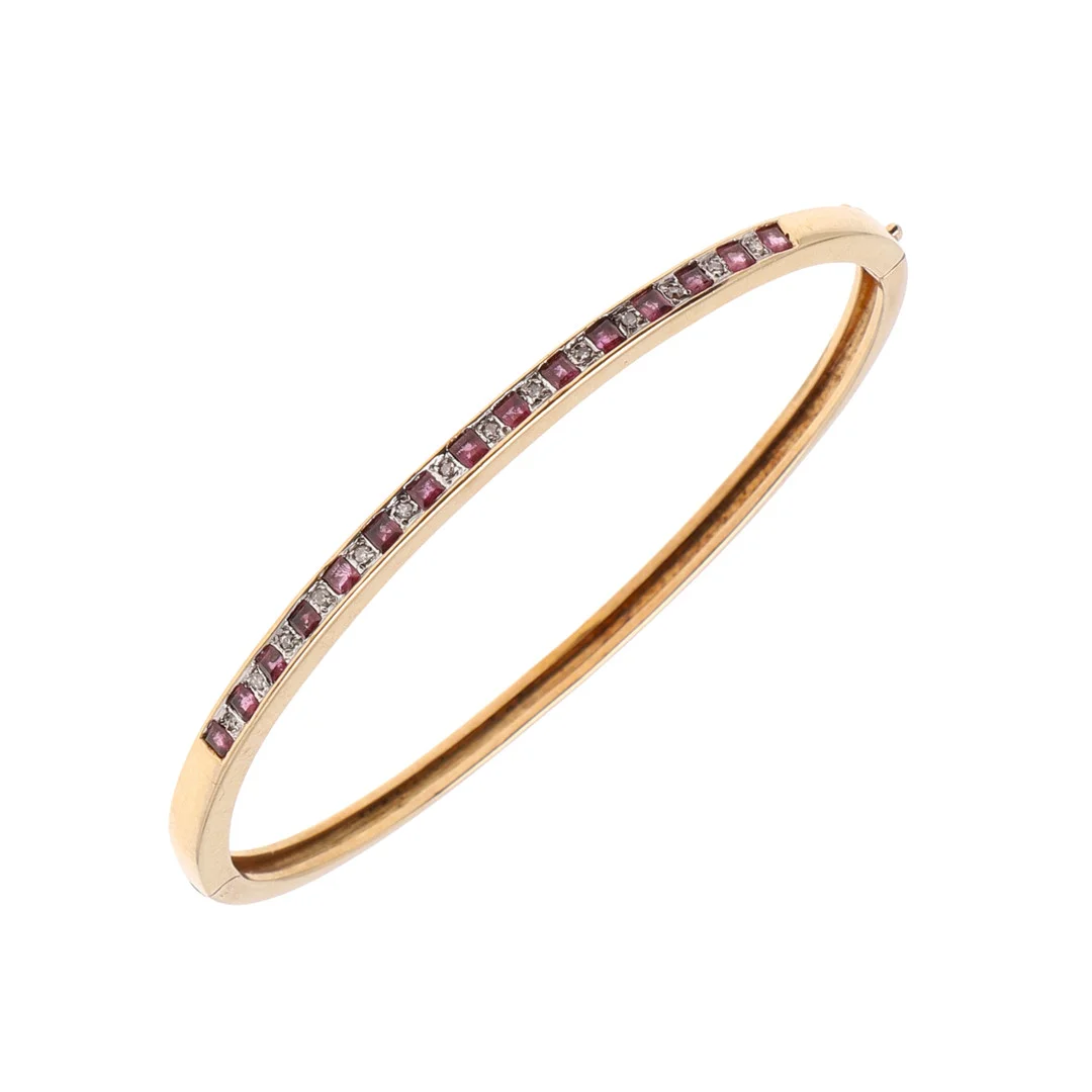 A RUBY AND DIAMOND HALF HINGED BANGLE. — Bracelets — Lawrences Auctioneers