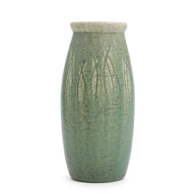 Stoneware vase, incised with linear pattern, decorated with light green glaze. Stamped Saxbo, Denmark. H. 22 cm.