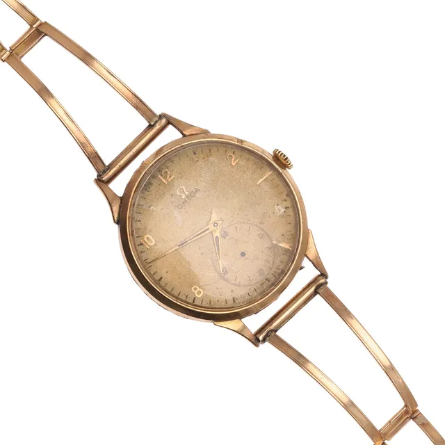 AN 18CT GOLD MECHANICAL WRISTWATCH BY OMEGA.