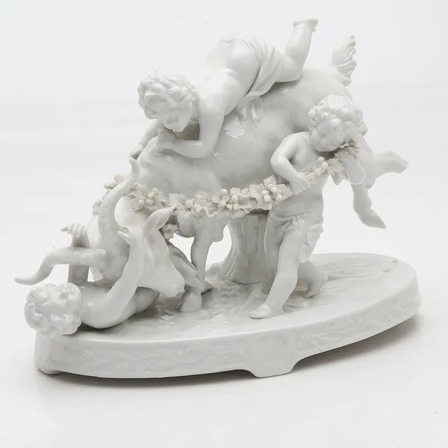 "Bacchic children with a goat", glazed porcelain group by Müller & Co., 20th Century.