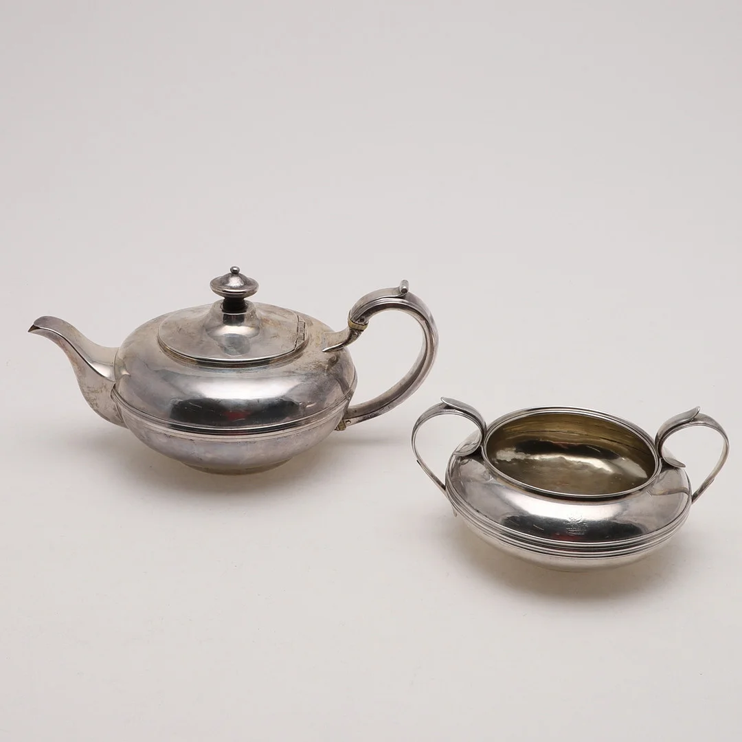 A VICTORIAN SQUAT-CIRCULAR TEAPOT. — Silver — Lawrences Auctioneers