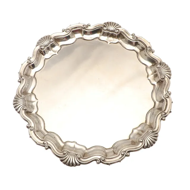 AN EARLY 20TH CENTURY SILVER WAITER.
