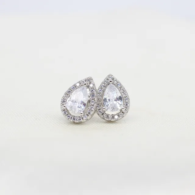 SILVER PEAR SHAPED HALO STUDS.
