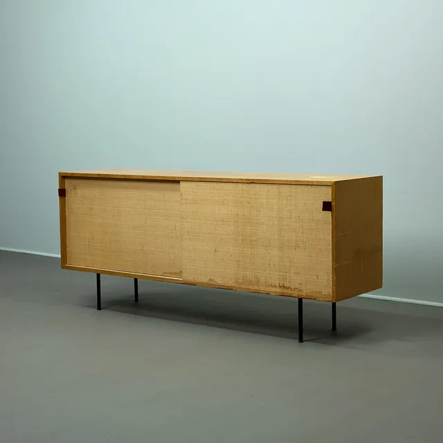 FLORENCE KNOLL. Knoll International, Sideboard / Anrichte, Modell 116, Holz, Bast, Leder, 1950er Jahre.