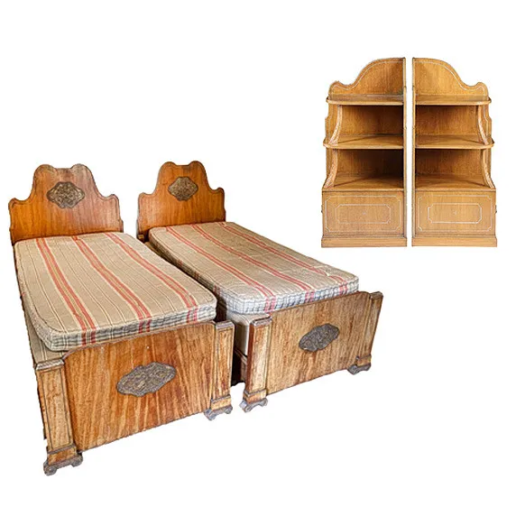 A PAIR OF 1930S HUNGARIAN ASH AND PARCEL GILT SINGLE BEDS TOGETHER WITH A PAIR OF BEDSIDE CUPBOARDS (4).