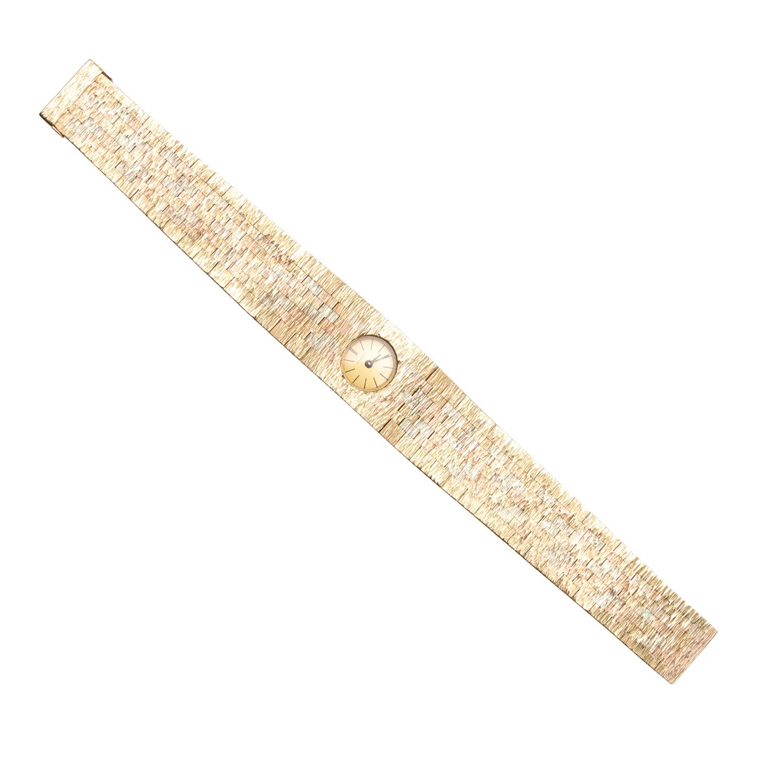 A LADY'S 9CT THREE COLOUR GOLD WRISTWATCH BY BUECHE-GIROD. — Wristwatches — Lawrences Auctioneers
