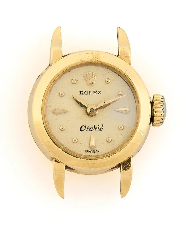 Orchid of 18k gold, ref. 9259. Mechanical movement with manual winding. Ø 15 mm. 1940s.