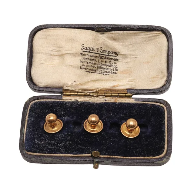 THREE 18CT GOLD DRESS STUDS.