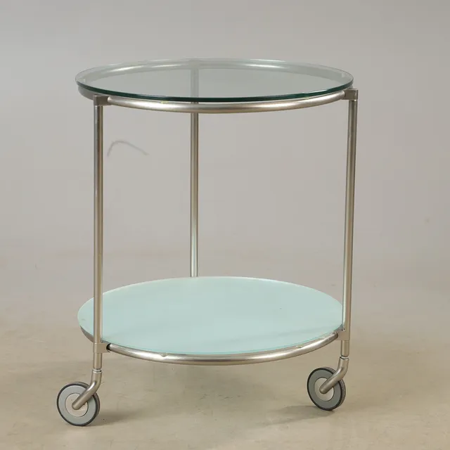 EHLEN JOHANSSON. Sidobord, 1 par. "Strind", IKEA, glas och kromad metall, på hjul.