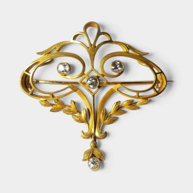 Broche Art Nouveau en oro y diamantes, de principios del siglo XX.