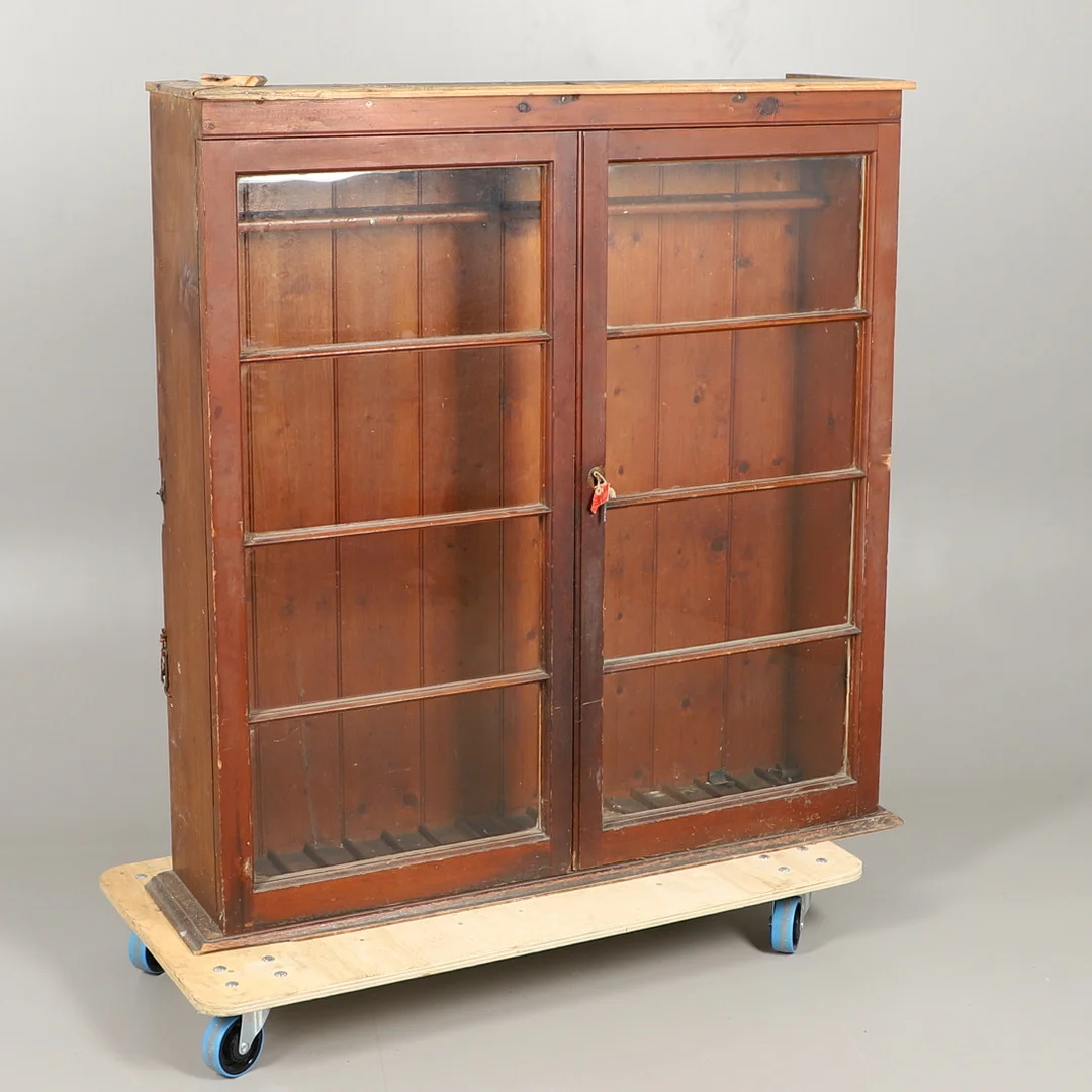 A PAINTED PINE GUN CABINET. — Cupboards, Cabinets & Shelves — Lawrences Auctioneers