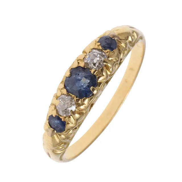 A SAPPHIRE AND DIAMOND FIVE STONE RING.