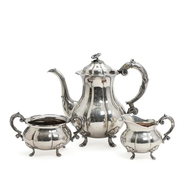 Silver coffee service comprising coffee pot, cream jug and sugar bowl. Manufactured by Cohr, Copenhagen hallmark 1946. Total weight app. 1210 g. H. 9.5–23 cm. (3)