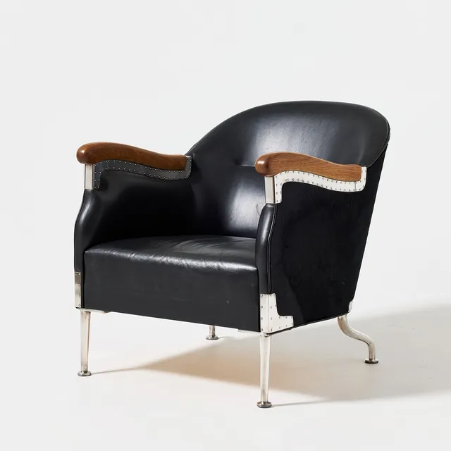 MATS THESELIUS. "Den svarta stolen", 2003, unique, upholstered seat and back interior covered in black leather, exterior covered in black pony skin, walnut armrests.