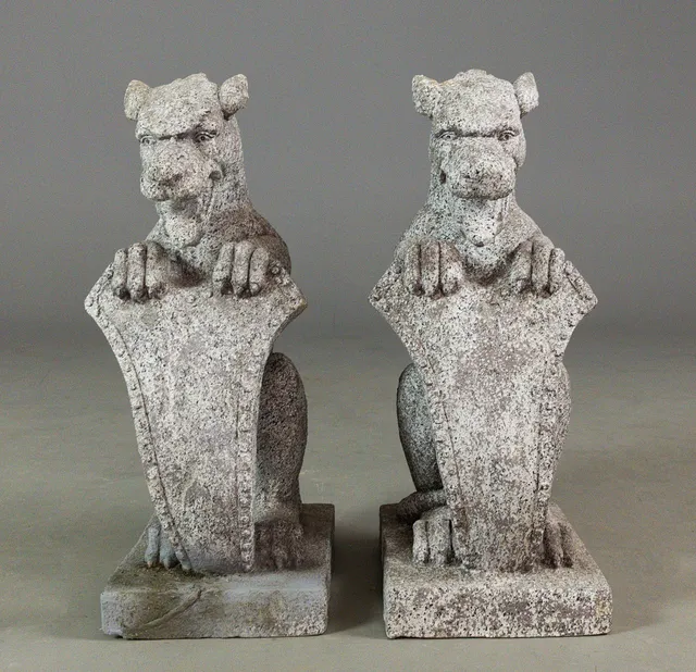 SCULPTURAL FAUX STONE GARGOYLES, A PAIR.