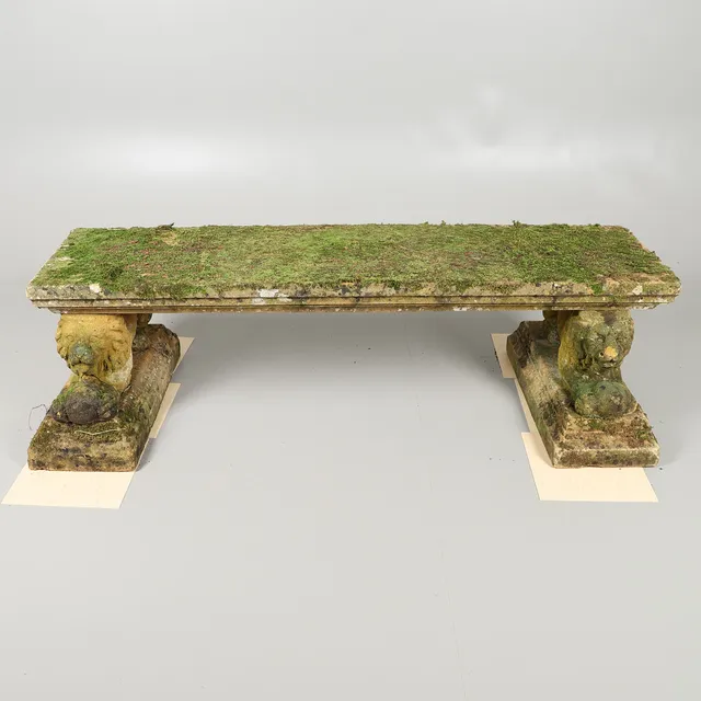A GARDEN STONEWARE BENCH.