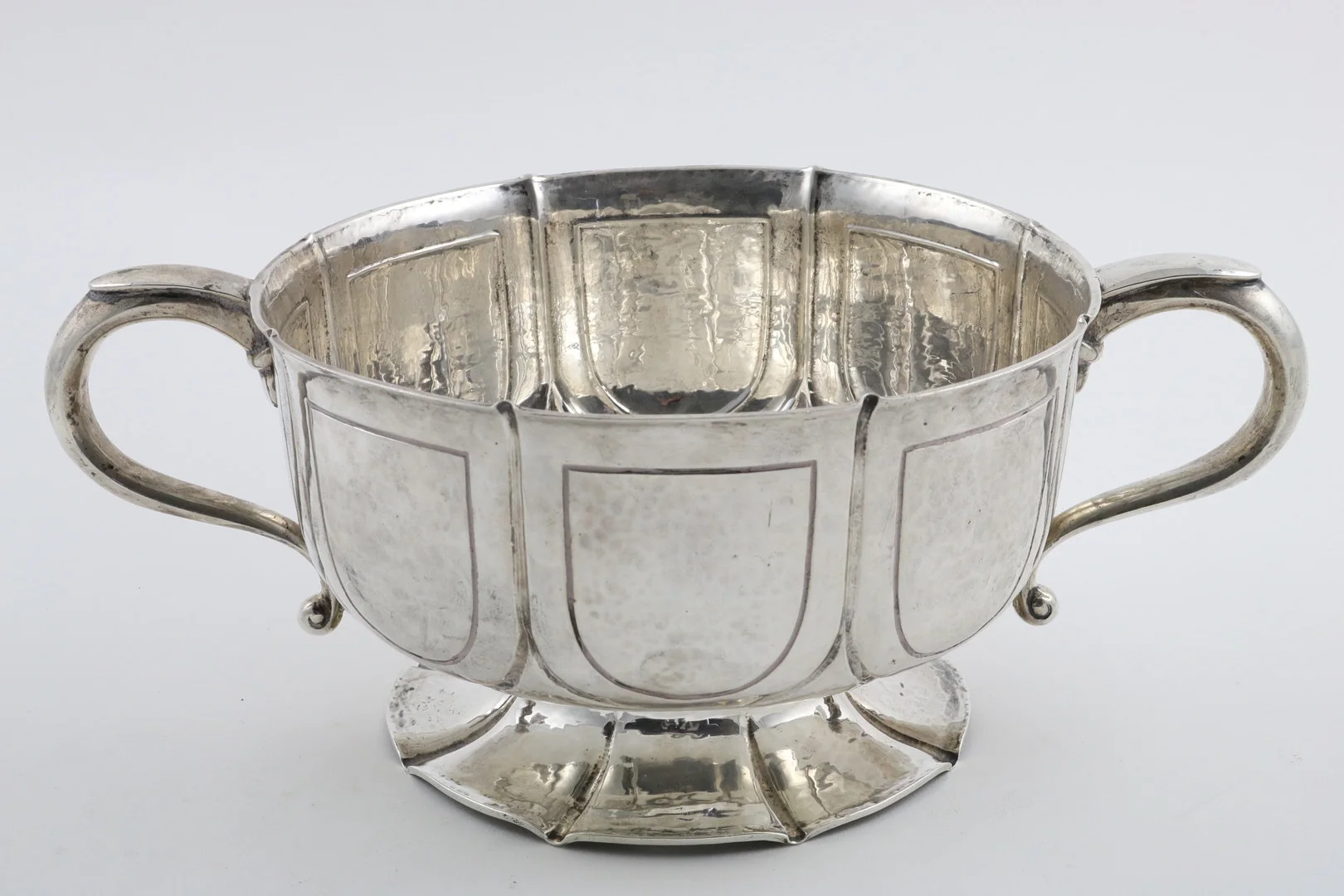 AN EDWARDIAN ARTS AND CRAFTS TWO-HANDLED BOWL. — Silver — Lawrences Auctioneers